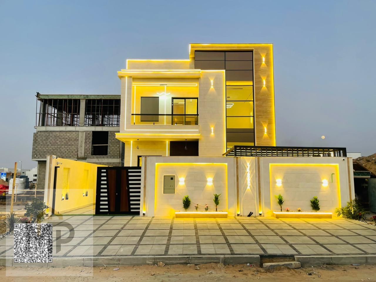 Direct from the owner, including ownership fees: a villa in one of Ajman's most luxurious villas, built and finished to a super deluxe standard, with