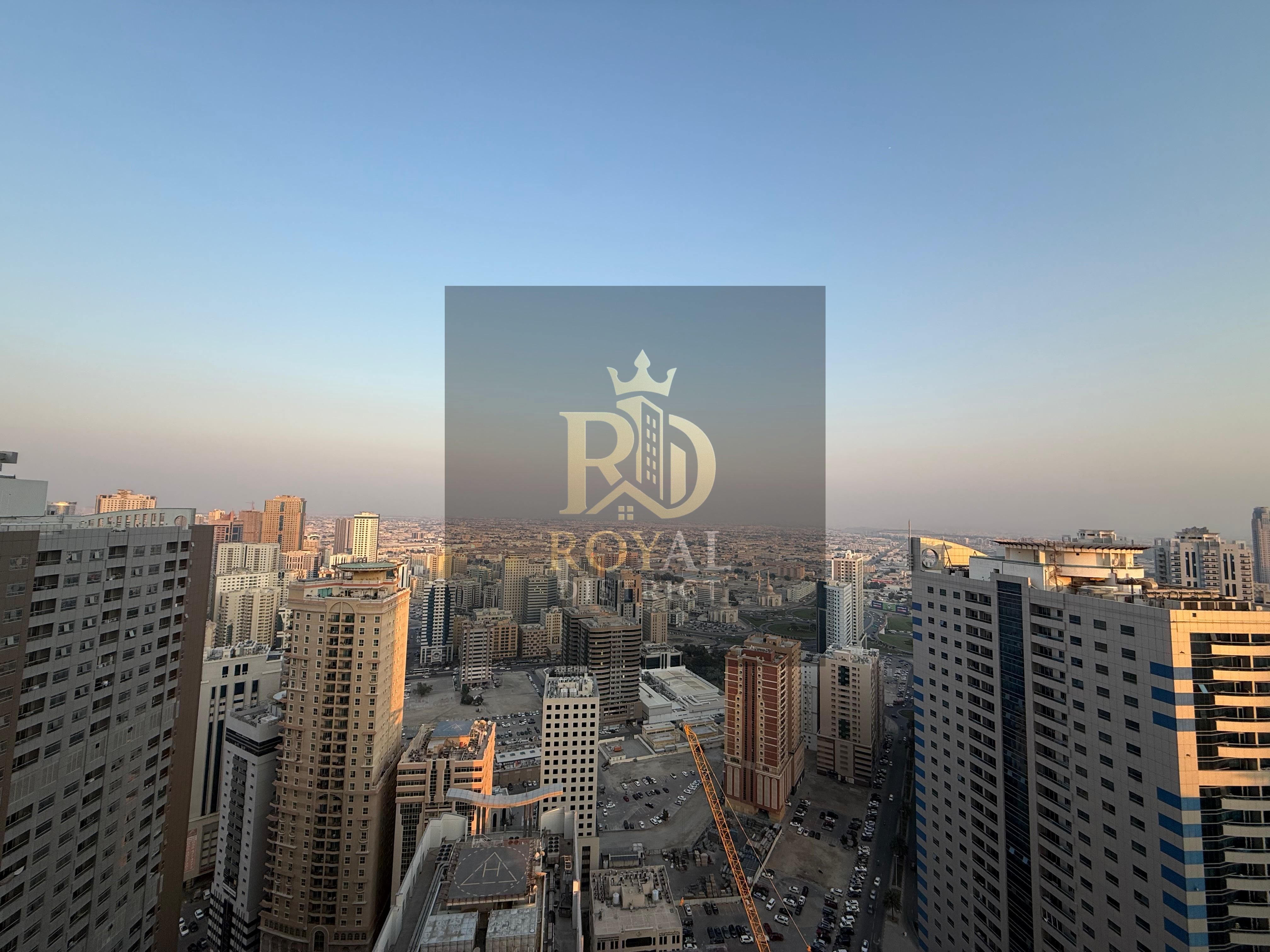 ELEGNT 2-bedroom apartment\ Al Khan Corniche | featuring a living area | balcony+ and maid’s room | a building offering full amenities.
