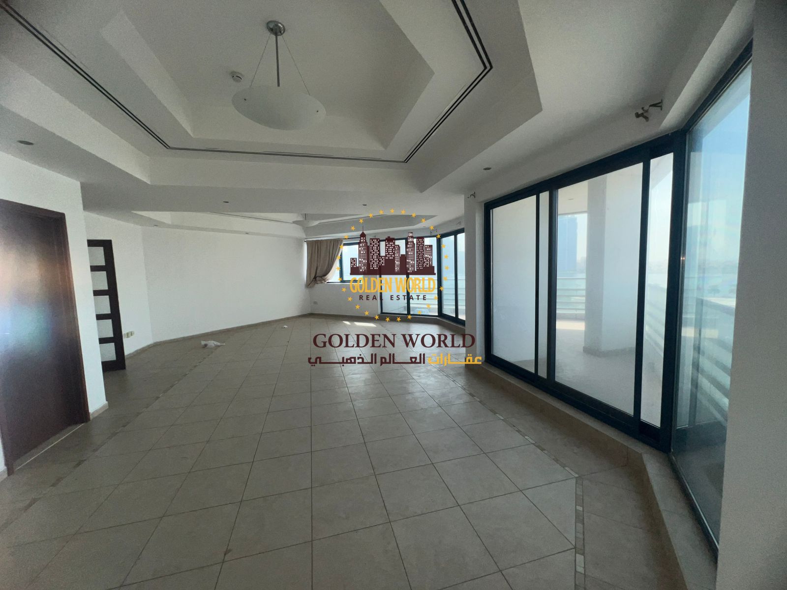 "3-bedroom apartment with living room for annual rent in Al Majaz 1, featuring large balcony, sea view, pool, gym, free parking, AC, and central gas"
