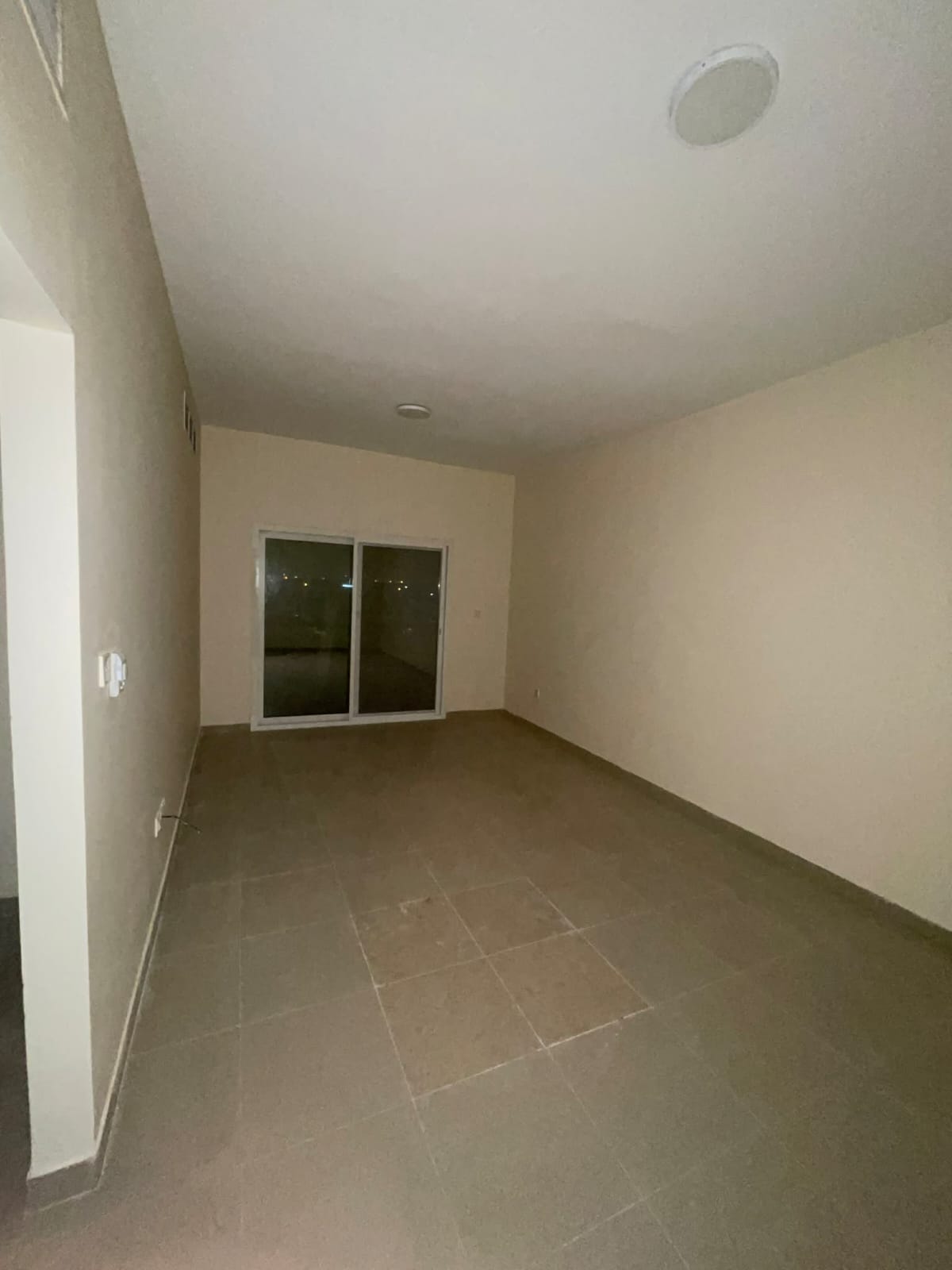 For rent in Muwaileh: 2BR apartment, 2 baths, balcony, prime location near schools & malls, directly on Mohammed Bin Zayed Road.