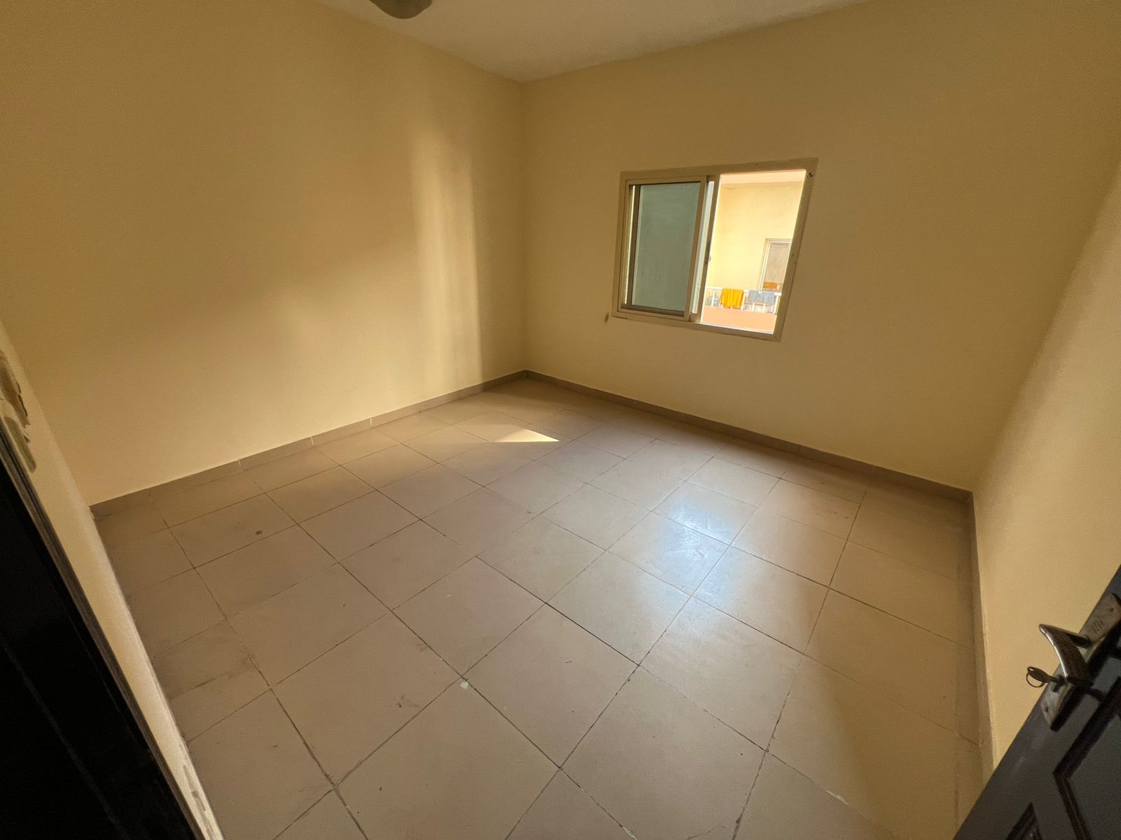 For annual rent in Al Nuaimiya, Ajman, a three-bedroom apartment with a spacious layout and excellent design, strategically located near Al Hikma Scho