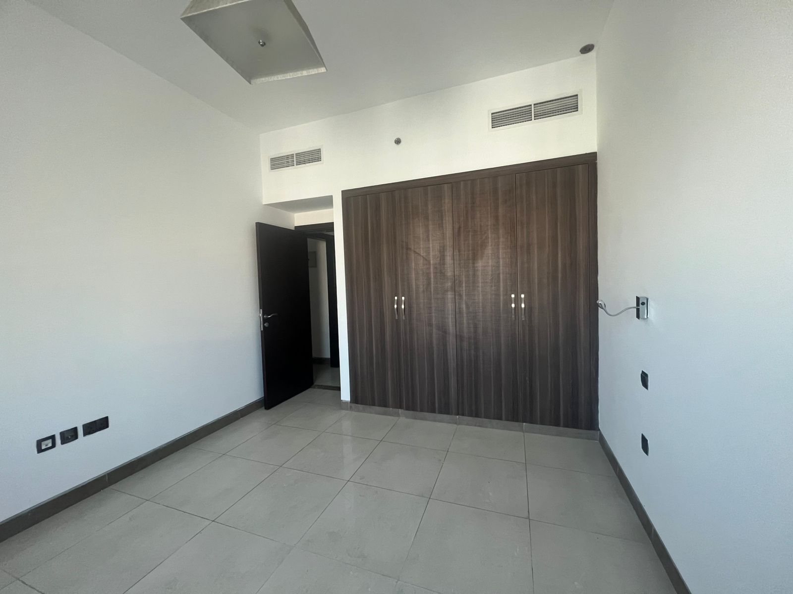 One-bedroom apartment in Al Qasimia Tower with free parking, gym, swimming pool, second tenant, built-in wardrobes. Annual rent AED 38,000, 4 or 6 pay