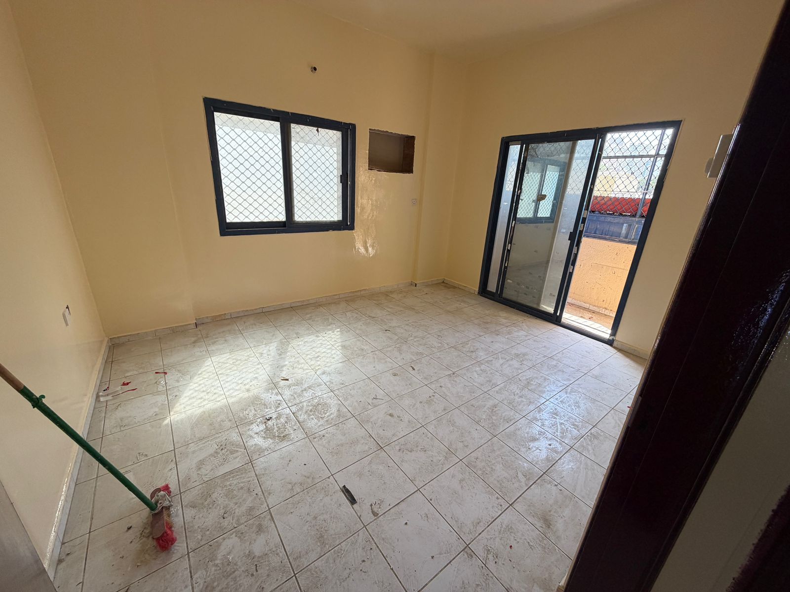 For only 25,000, a two-bedroom apartment with a living room, second row on the Ajman Corniche.