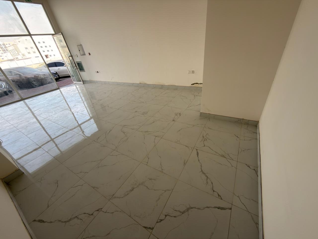 Commercial shop for rent in Al Rawda 3, Ajman. Annual rent. Prime location close to all services.