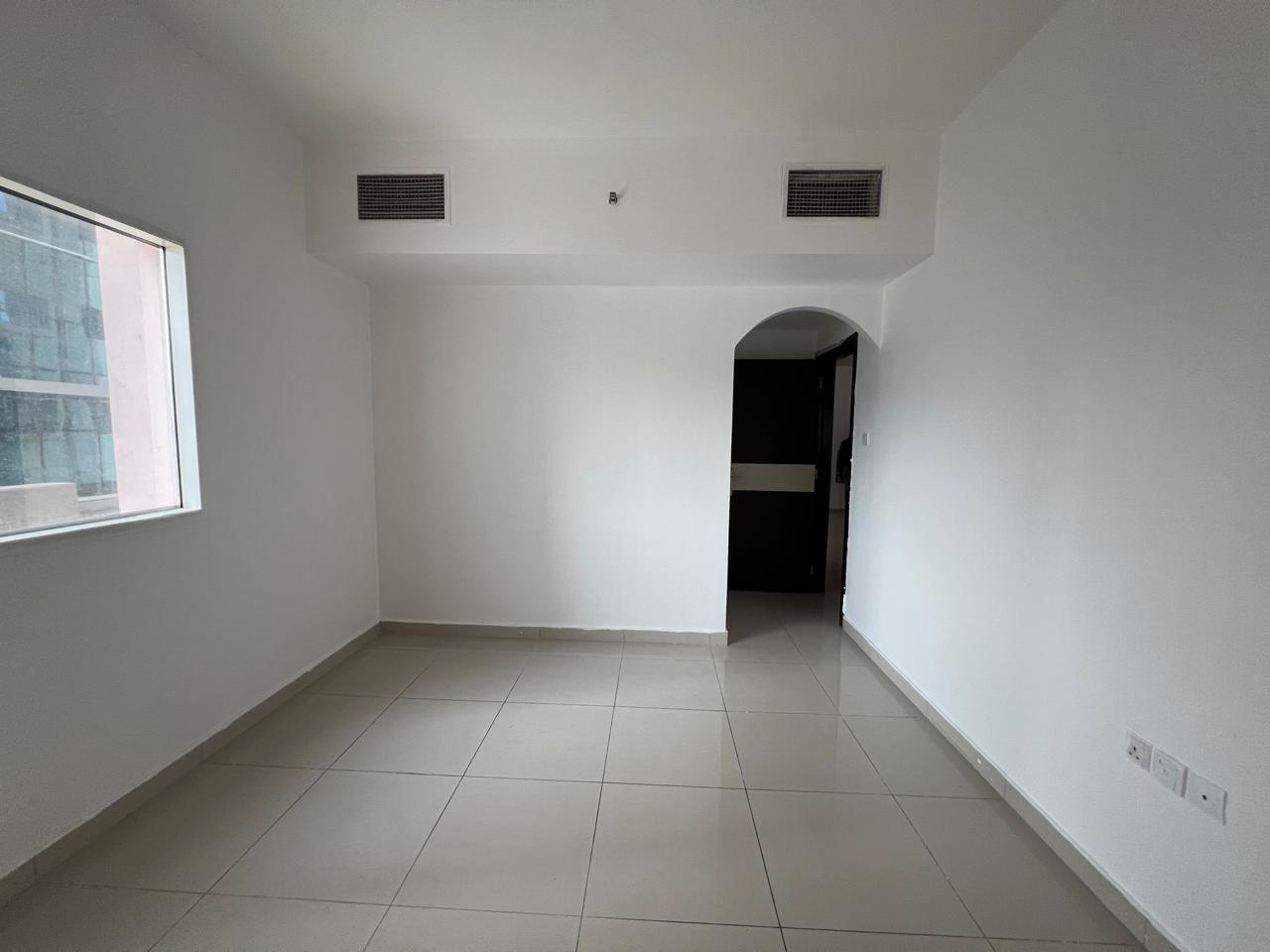 Two-bedroom apartment in Al Taawun with parking, annual rent AED 48,000, 4 or 6 installments, AED 2,000 security deposit.