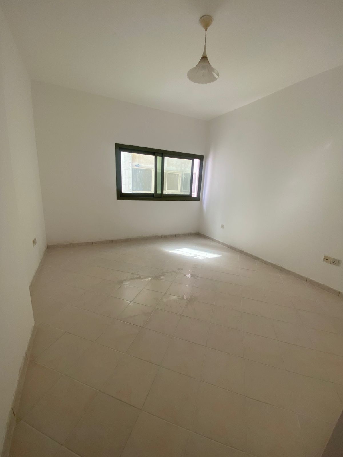 1BR apartment in Al Majaz 1, large hall, spacious kitchen, central AC, built-in wardrobes, comfortable layout, prime location.