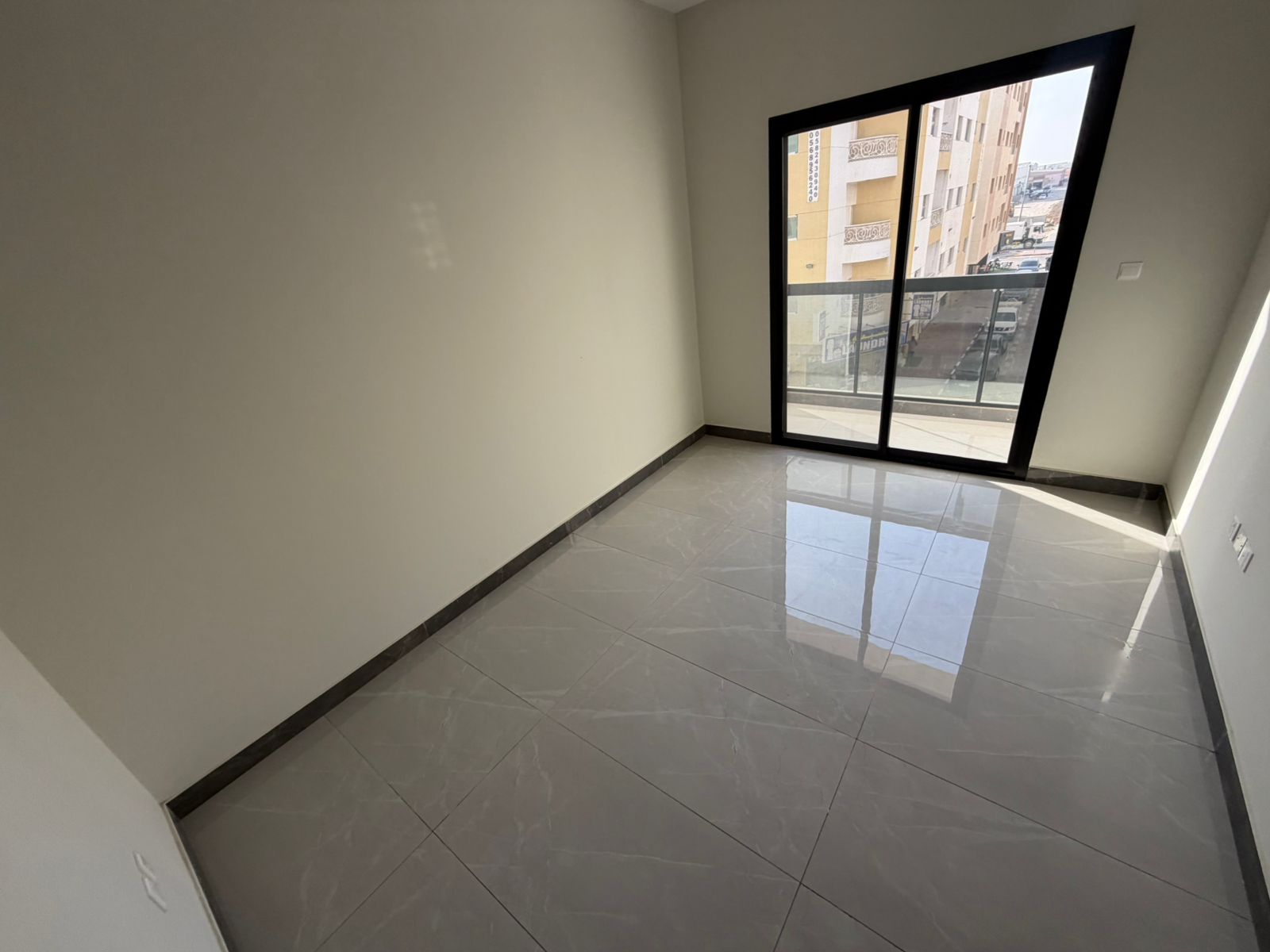 For annual rent in Al Jurf 3, a stunning apartment in a brand new building, never before occupied, with a spacious layout and modern finishes, ideal f