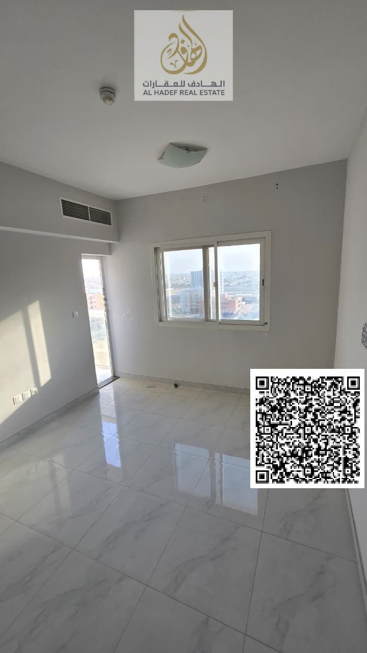 Two-bedroom apartment with a living room, separate unit in Al Jurf 3, second occupancy. Two master bedrooms, three bathrooms, balcony, and parking. Cl