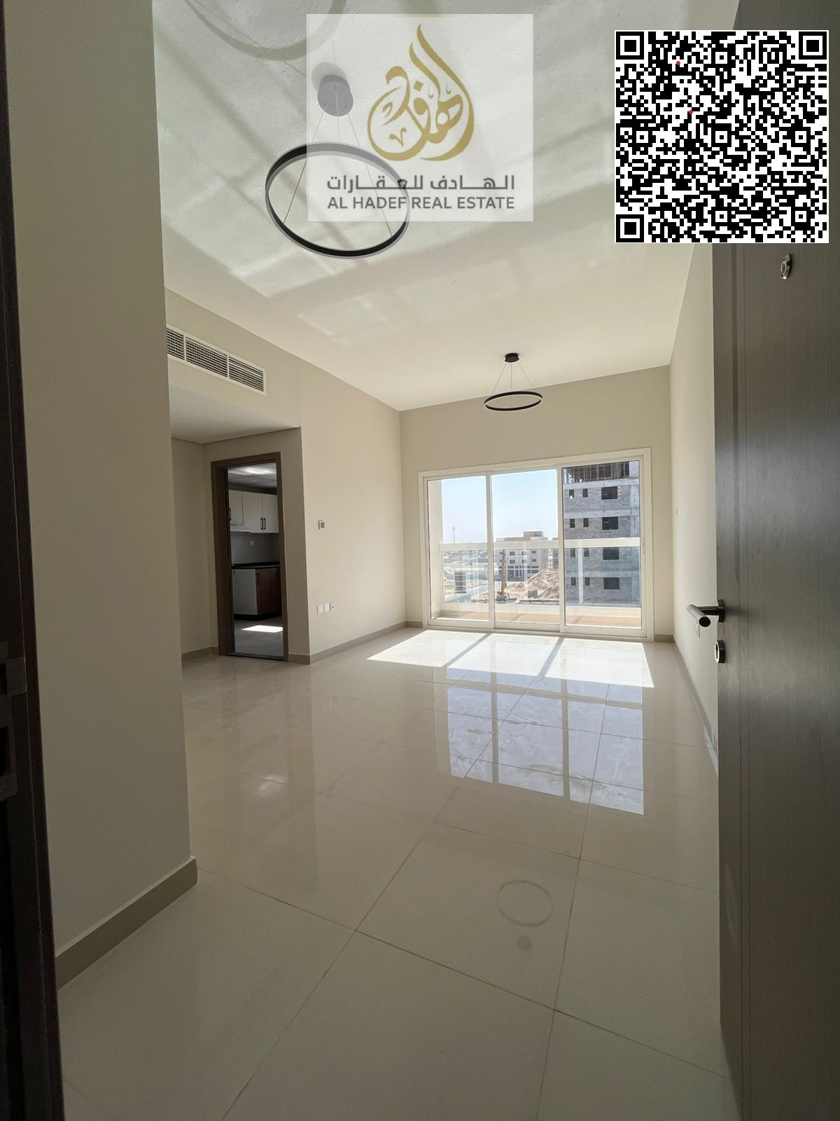A brand new building has opened, ready for its first occupants. It features two bedrooms, a living room, three bathrooms, spacious areas, excellent fi