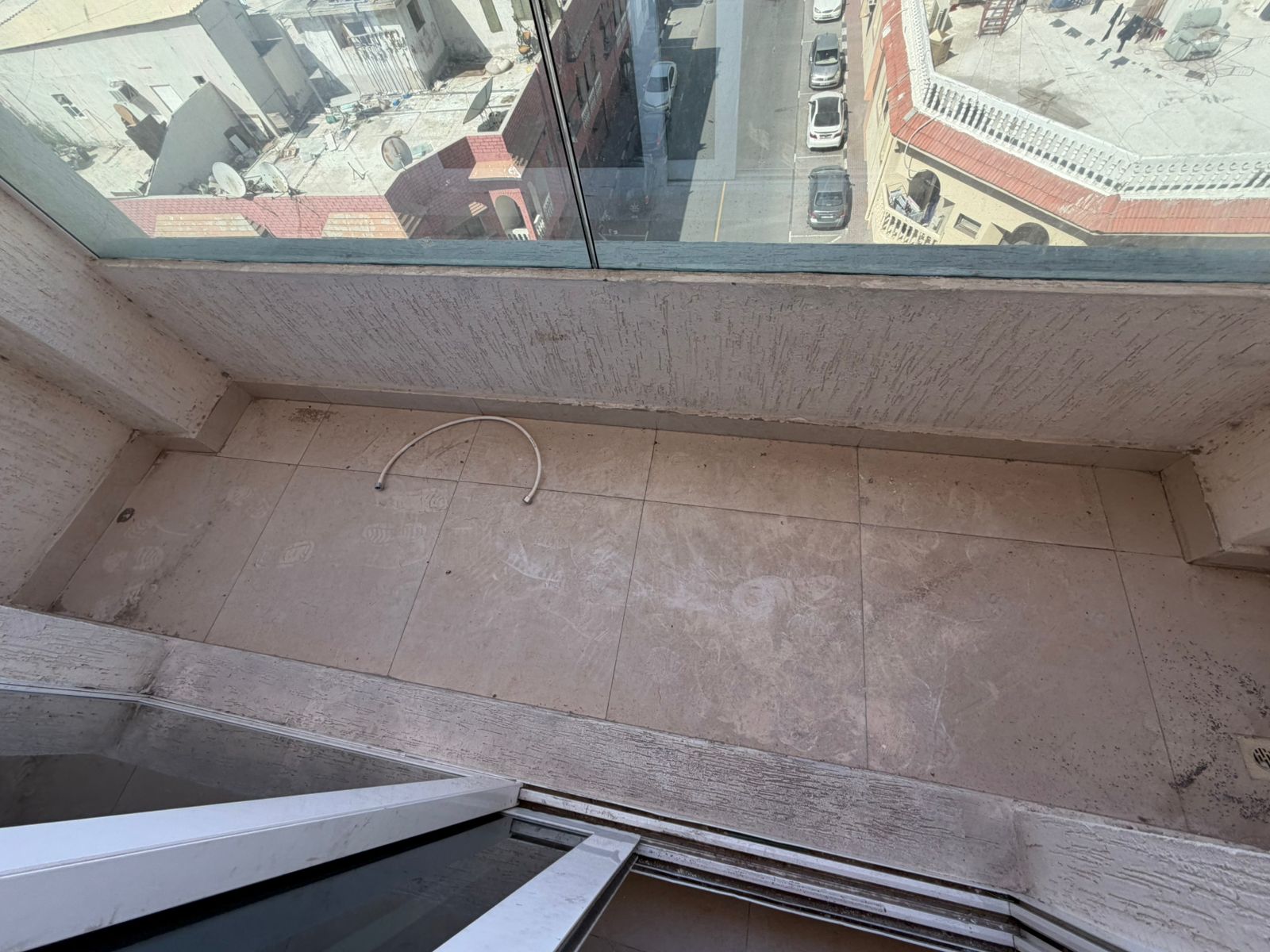Brand new, second-occupancy, two-bedroom apartment with a living room for annual rent in Al Nuaimiya, Ajman. Prime location near Al Hikma School.