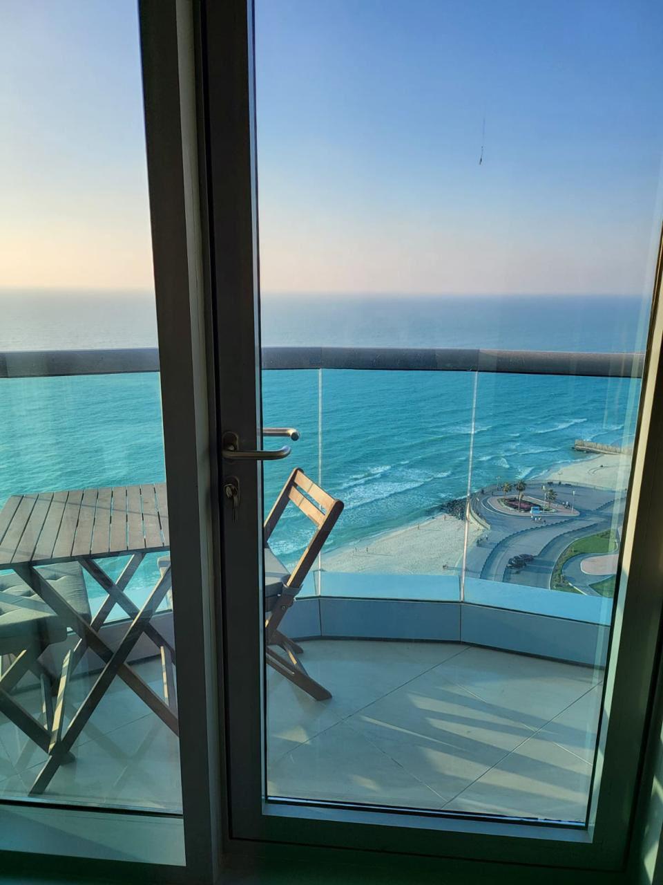 Furnished 2BHK for monthly rent in Corniche Residence Ajman, full sea view, all bills, gym, pool, parking included.
