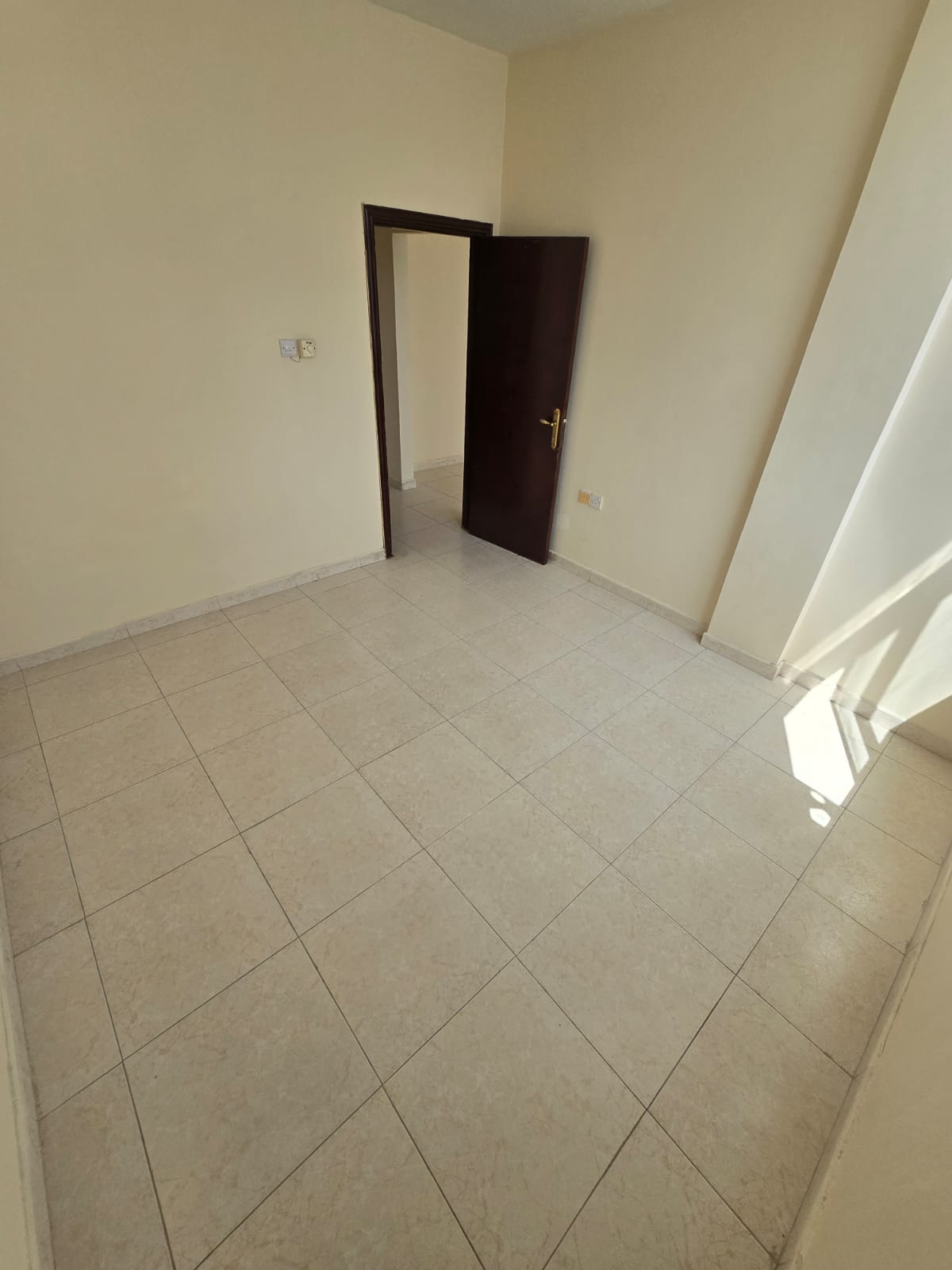 A large one-bedroom apartment with a living room. Al Qasimia, an excellent building close to all amenities.