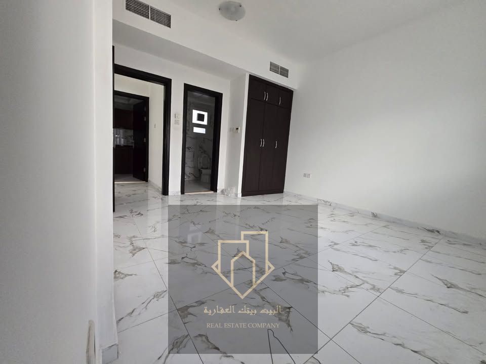 Master bedroom, spacious living room, 2 bathrooms, built-in wardrobes, balcony, smart card entry system, prime location in Al Rashidiya next to Ladies Park.