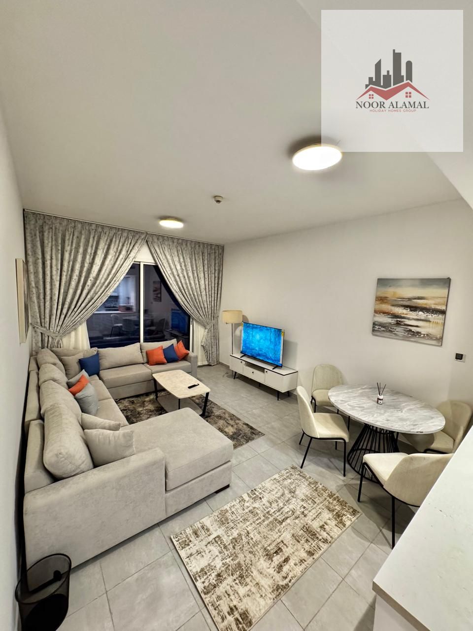 Dubai Liwan, one bedroom and living room, super deluxe, first occupancy, balcony, 2 bathrooms. Price 8500 AED including all bills and parking.