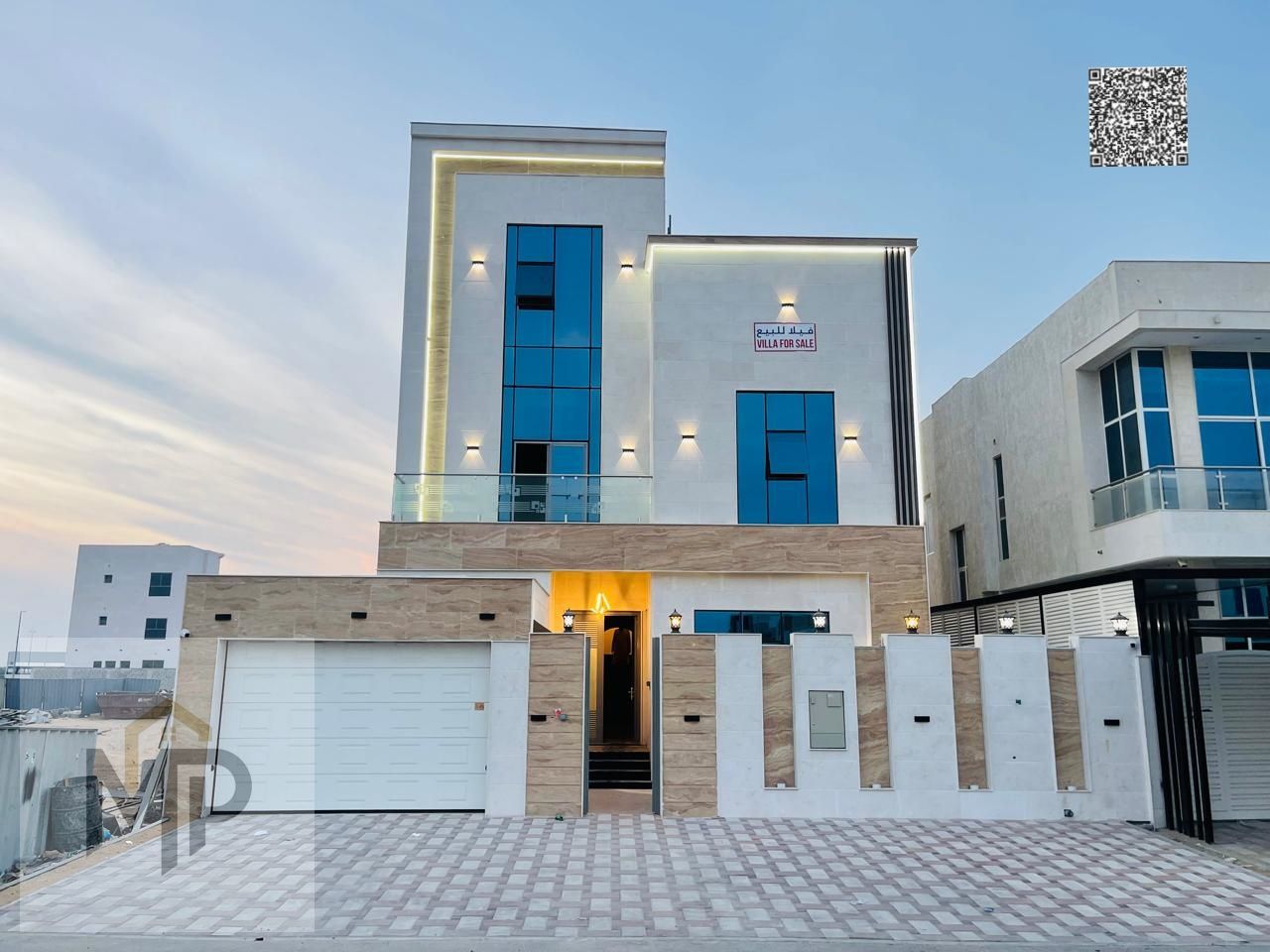 A villa with a price including registration and ownership fees on the main street, ready for living in the most prestigious areas of Ajman, freehold f
