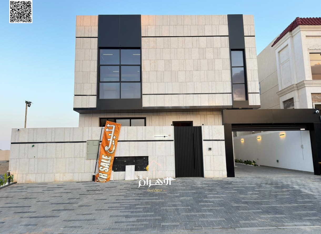Luxury villa for sale in Al Bahia area, featuring two floors and a rooftop terrace. Modern design, spacious living areas, reception halls, and compreh