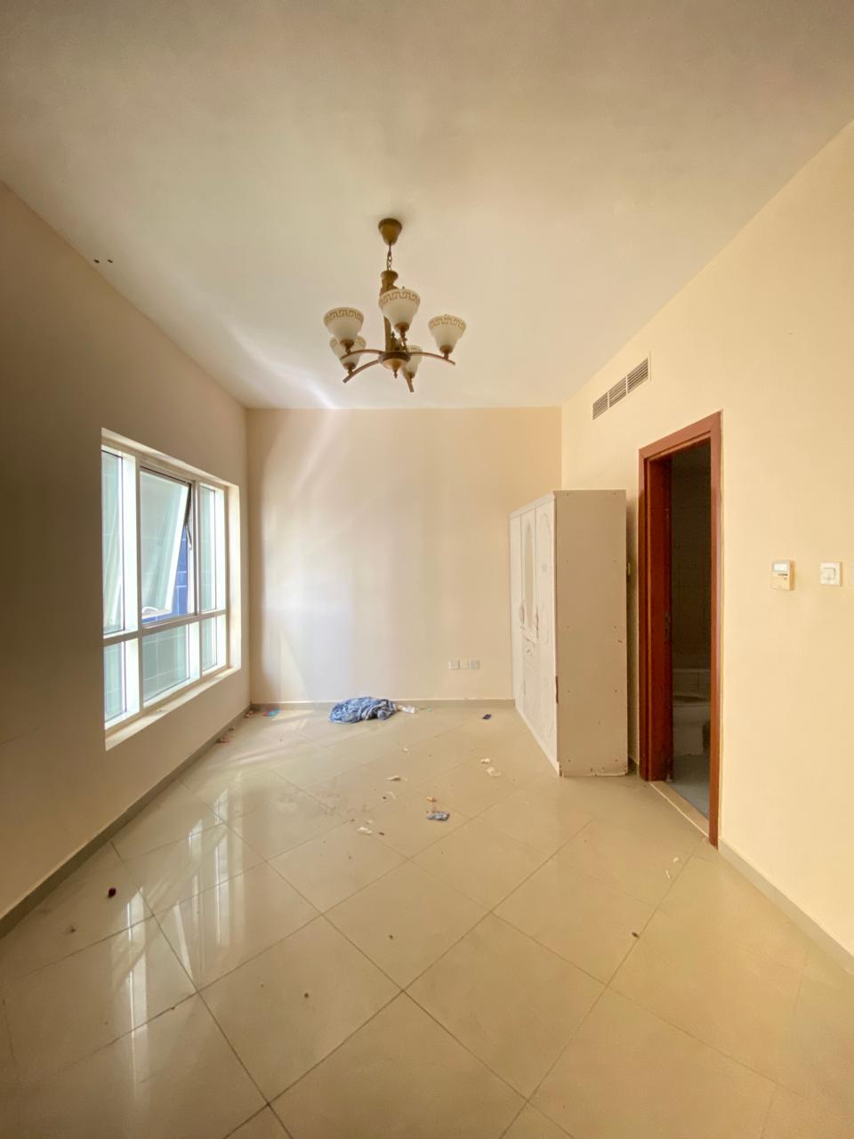 Prime location studio with fully family building just in 30k near sahara mall shj call umair
