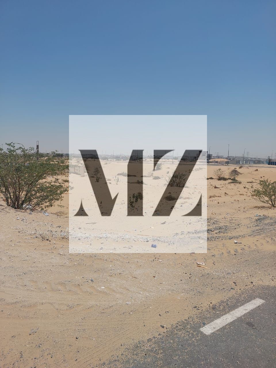Commercial corner plot for sale in Al-Hawshi, measuring 12,000