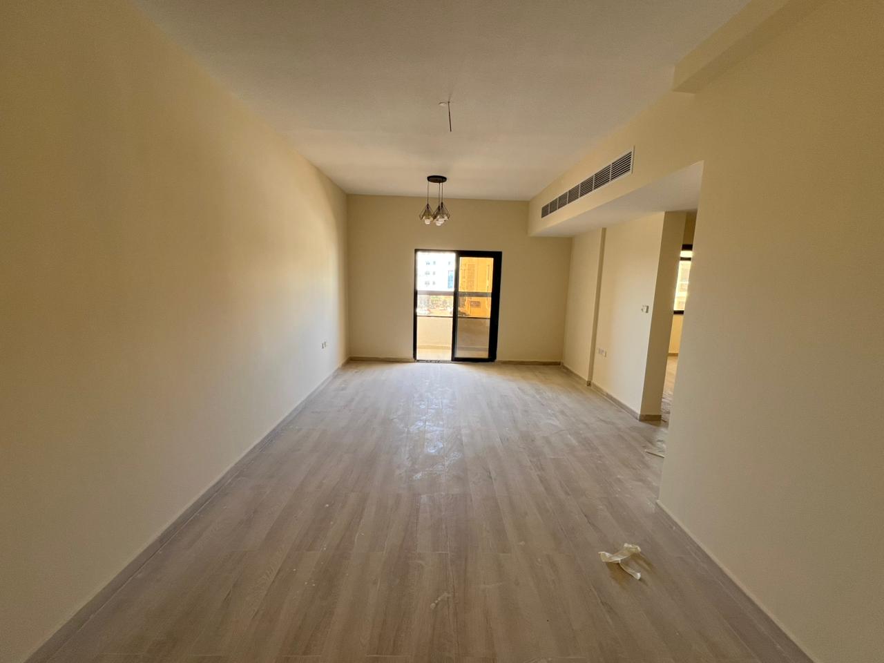 One bedroom and living room apartment for annual rent, first occupancy, in Al Jurf 3, behind the Chinese Market. Suitable for families. Maintenance is