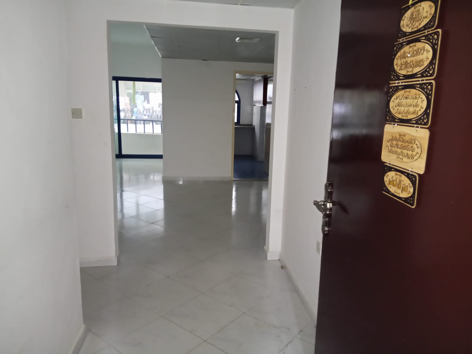2BR apartment in Al Majaz 3 on main road, 2 bathrooms, balcony, built-in wardrobes, central AC, rent AED 48,000/year, 4 or 6 checks.