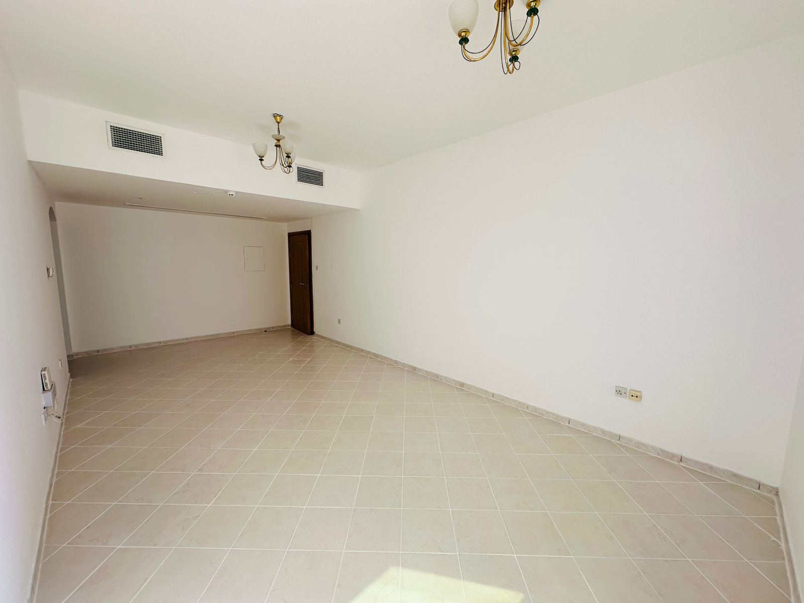 Largest 1BHK apartment with open view, free AC, and glass façade.