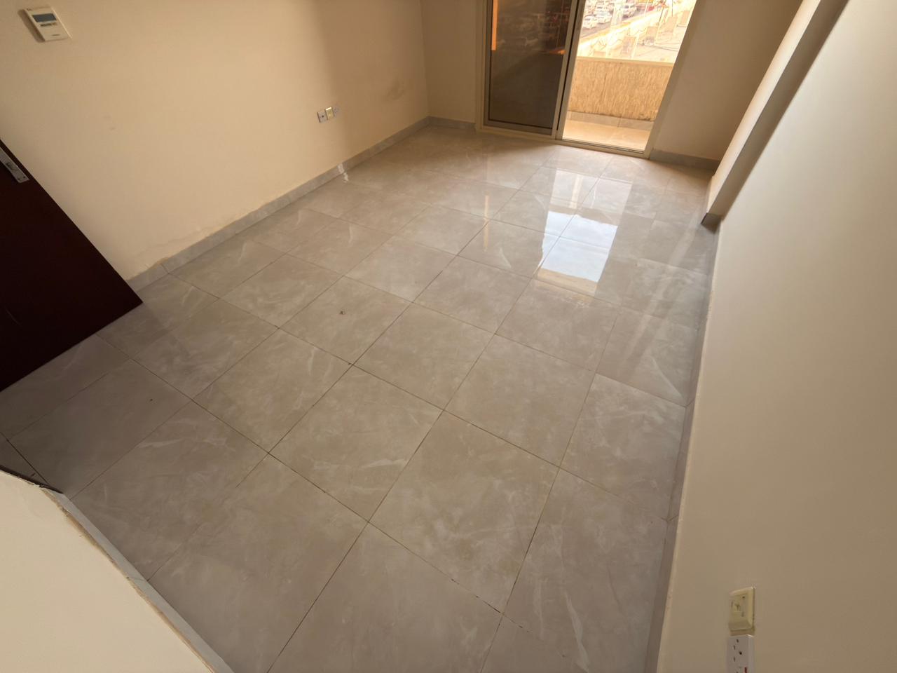 2 bedroom apartment for rent in Al Jurf 2 opposite Nesto, near Court and Ajman University, 2 baths, balcony, maintenance by tenant