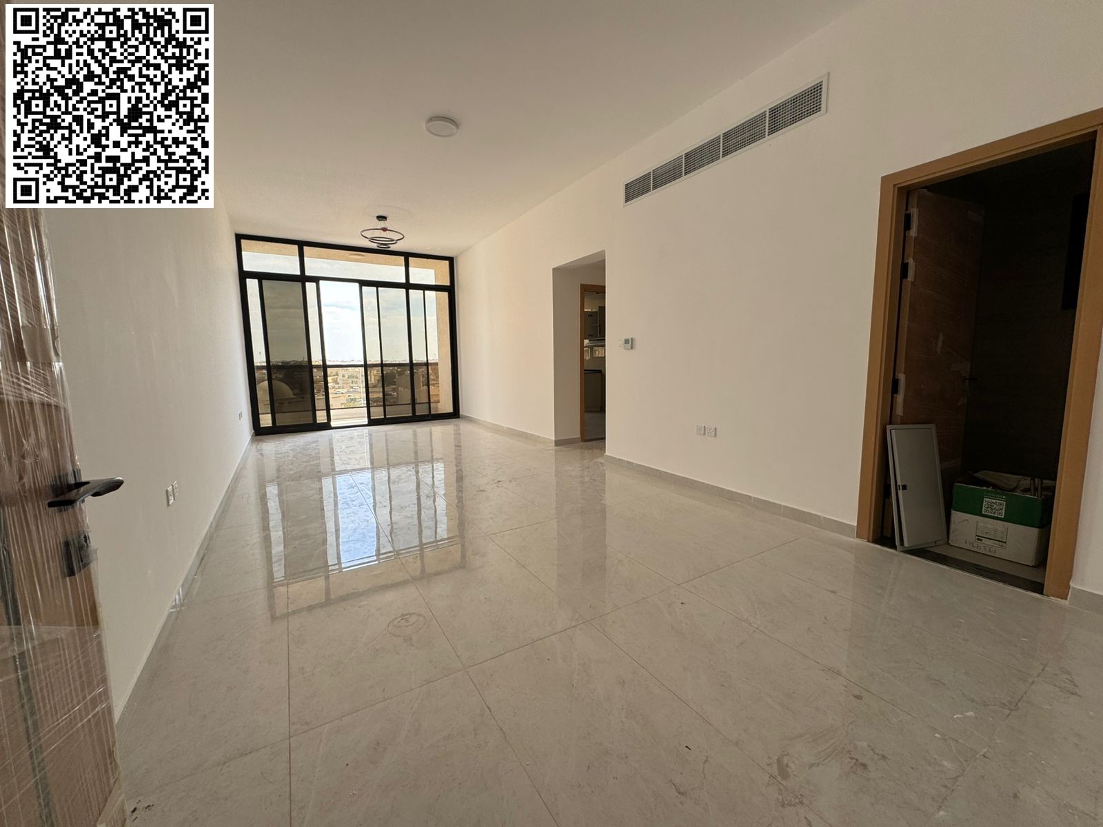 For annual rent in Ajman, a brand new building, first occupancy available. A two-bedroom apartment with a living room, three bathrooms, a balcony with