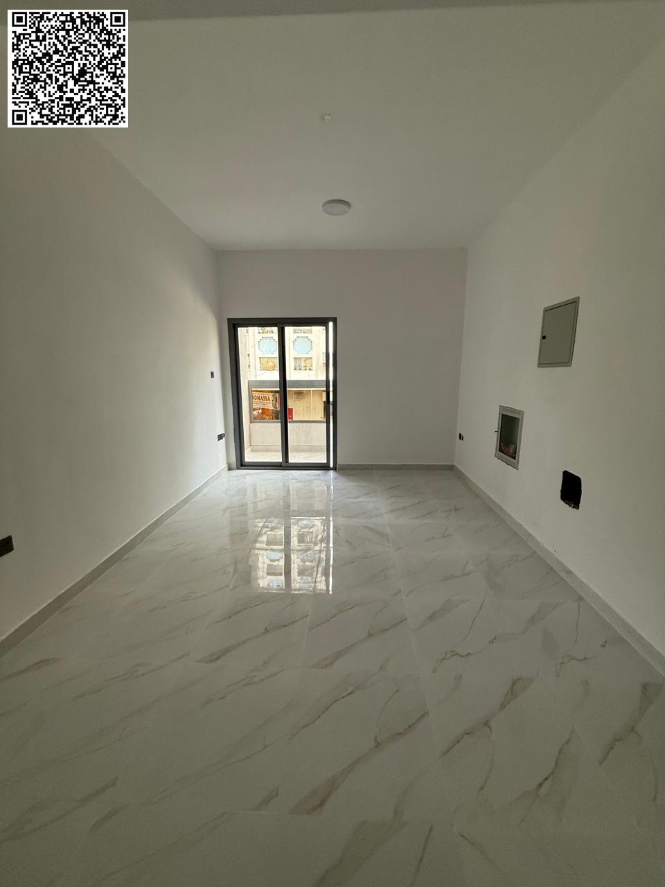 For annual rent in Ajman, a brand new building, first occupancy available. One-bedroom apartment with a living room, two bathrooms, and a distinctive