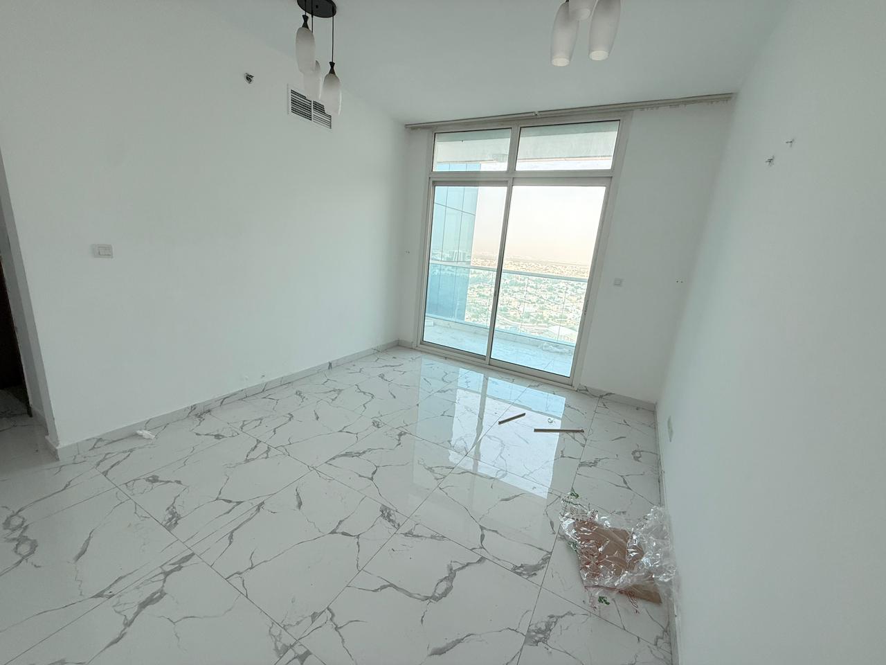 Two bedrooms and a living room - gym, swimming pool, and parking - full sea view - free maintenance - Al Waha Towers, Al Rashidiya