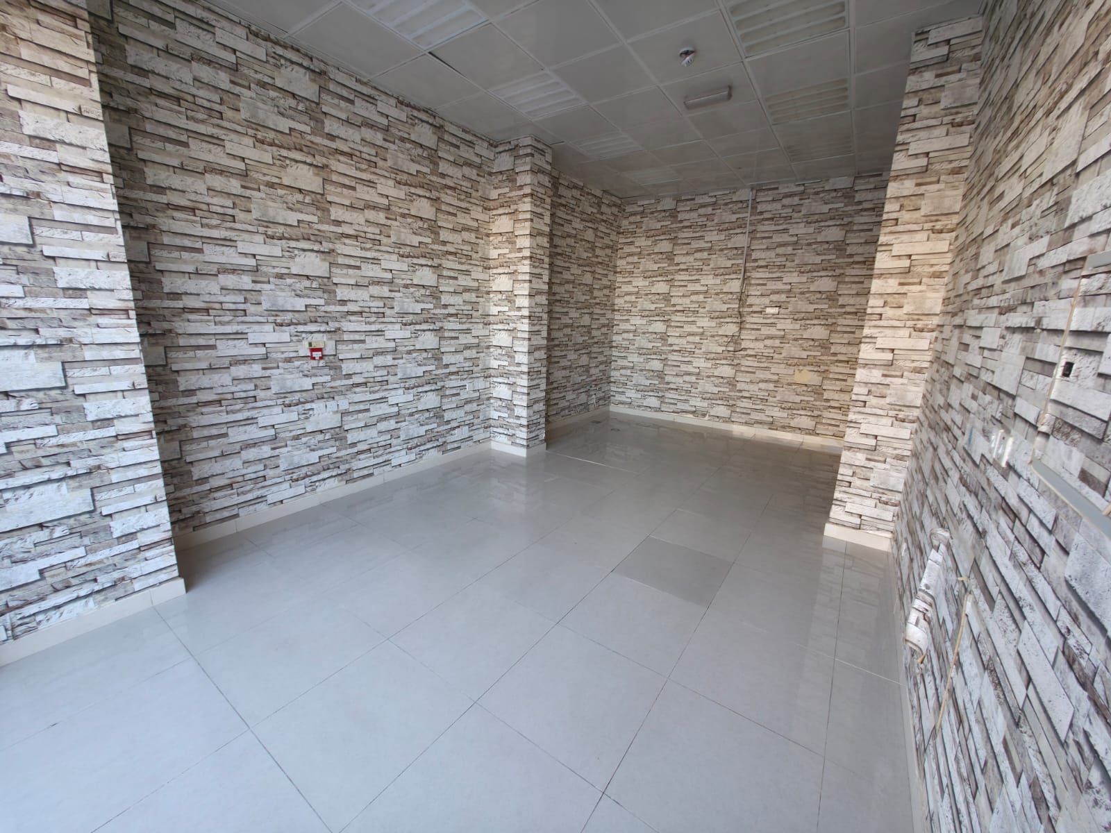 Commercial Shop for Annual Rent Near Sheikh Ammar Street | New Building on Main Road | Large Space | Drainage and Sink Inside | AED 23,000