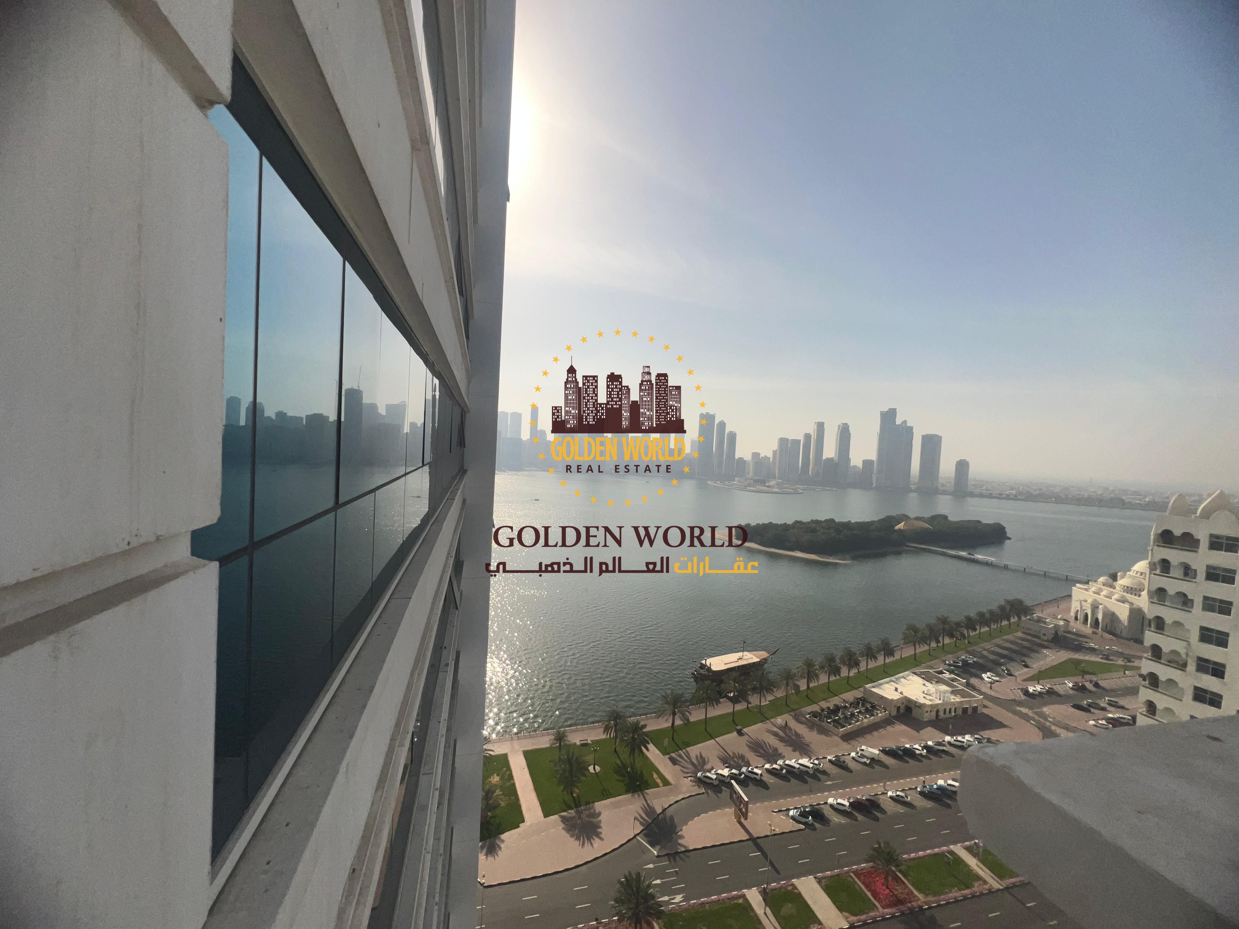 Two-bedroom apartment with living area in Al Majaz 1, master bedroom, balcony with sea view, spacious layout and full amenities