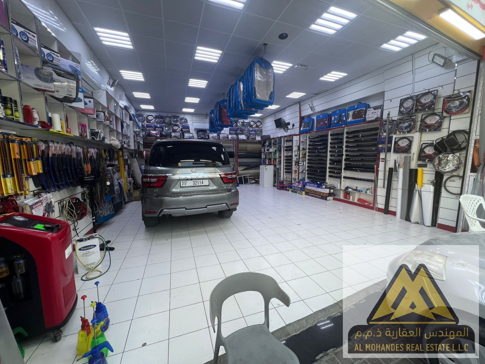 A large car accessories shop with an attached storage room.
