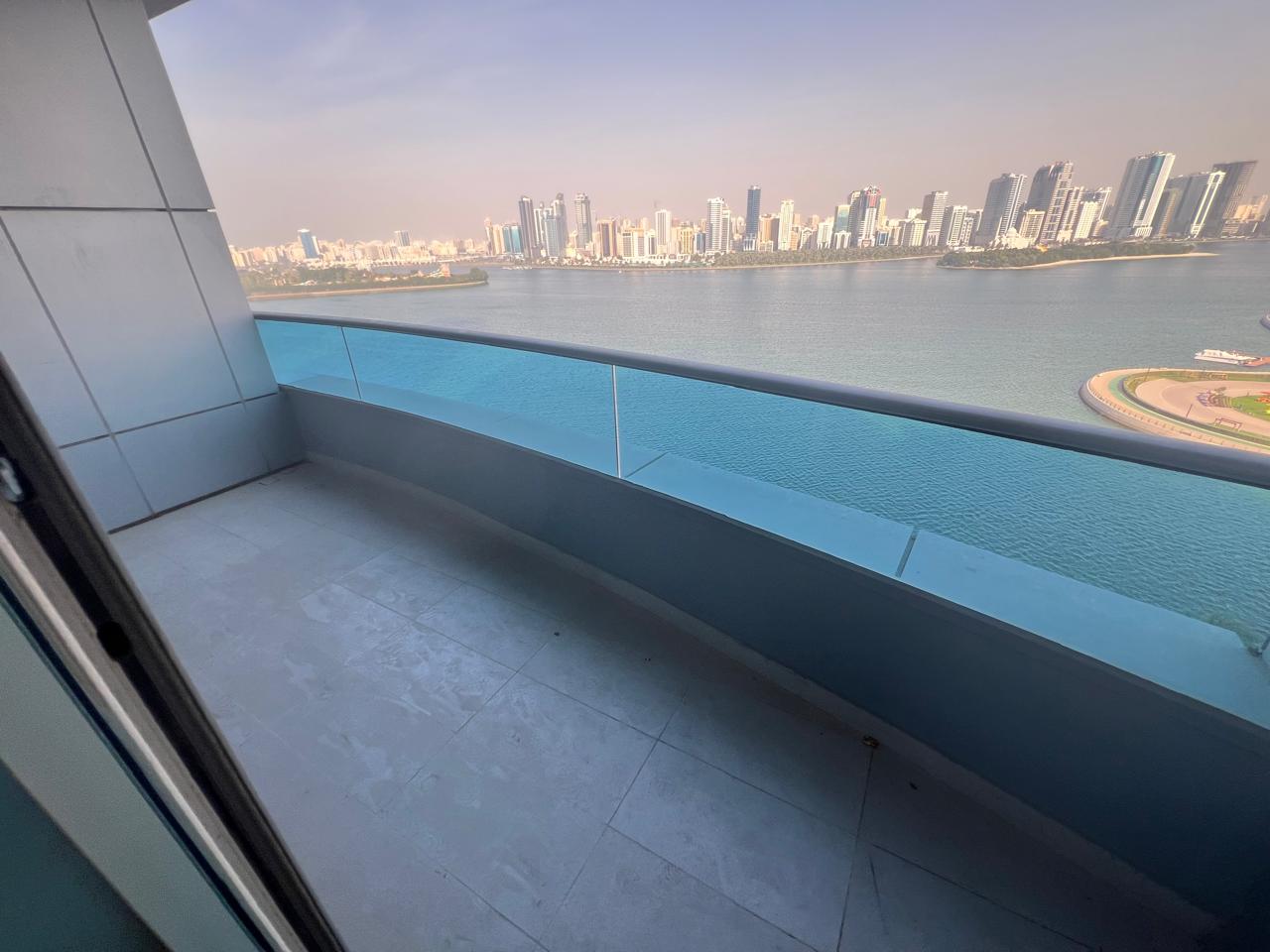 Spacious 3BR apartment in Al Majaz 3 with two halls, two balconies and full sea view, free AC, parking, gym and pool, rent AED 165,000.