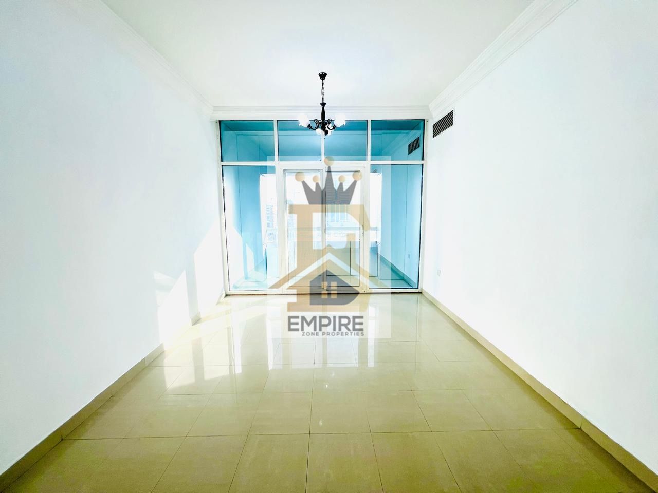 Luxury living with partial sea view big windows wardrobes balcony gym pool and kids play area free also maintenance free prime location near close exit to Dubai