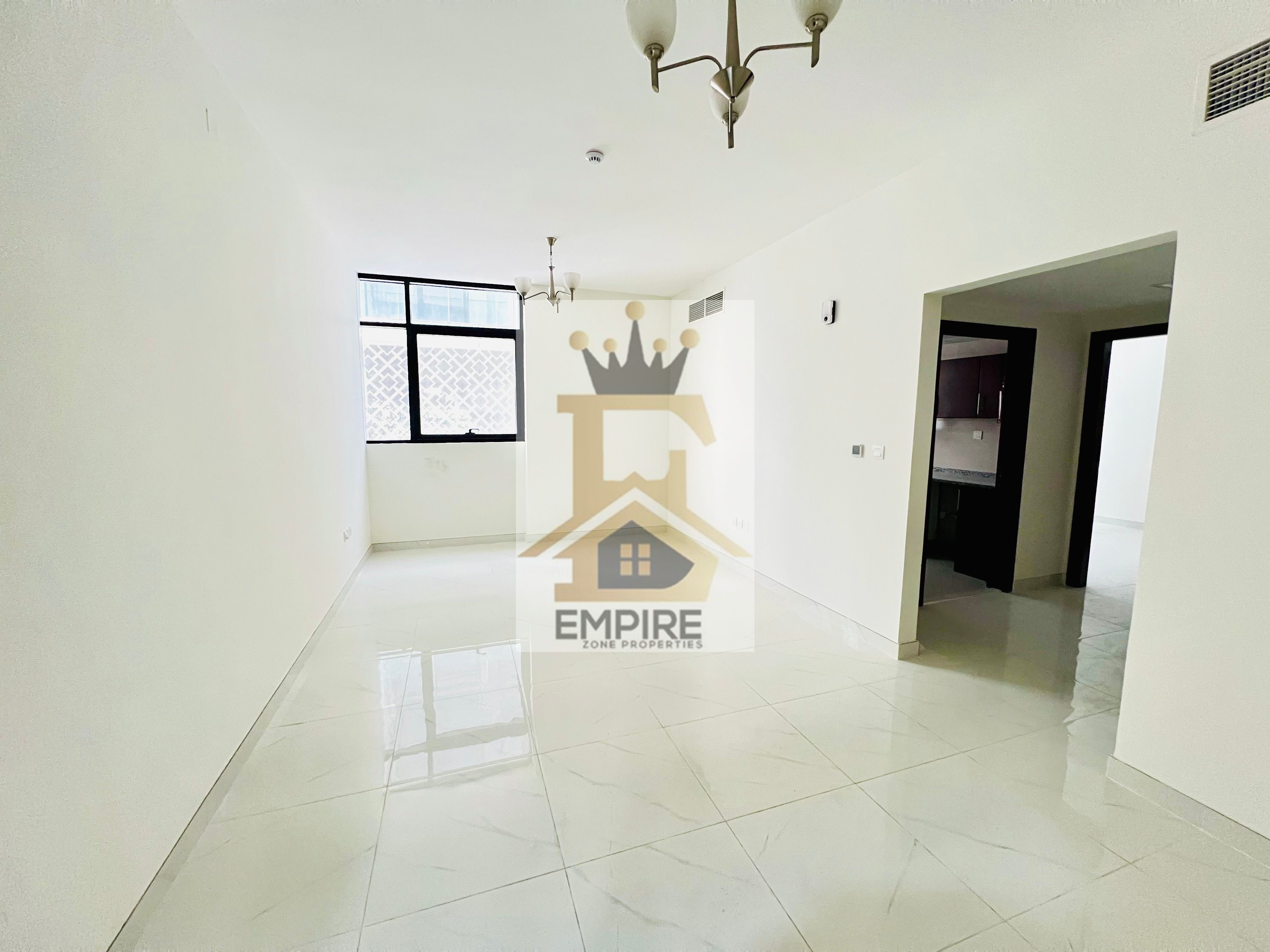 Brand-new building with balcony big space master room maintenance free one parking free exit to Dubai