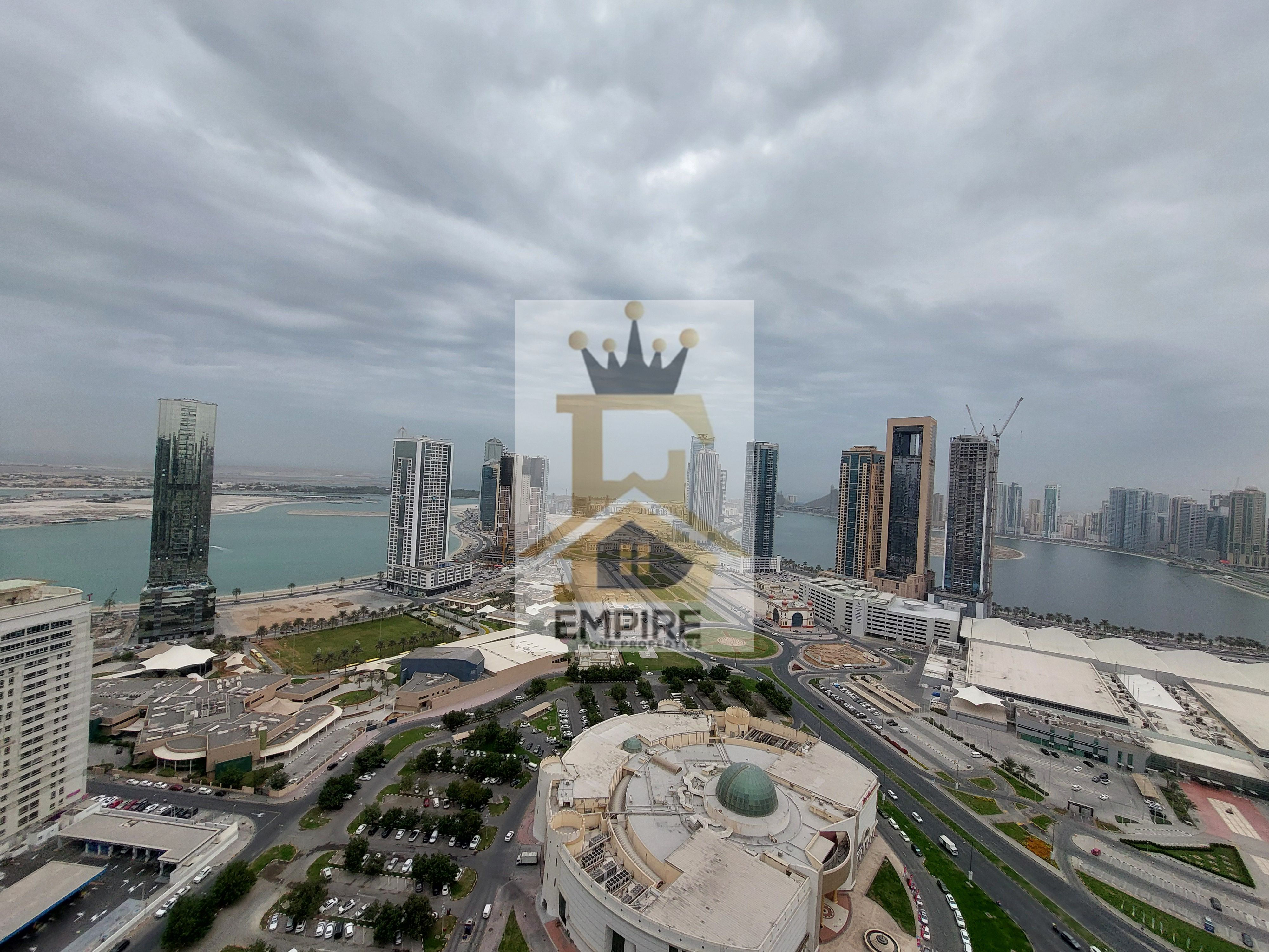 luxury living with full sea view balcony wardrobes gym&pool and maintenance free Prime location near close exit to dubai