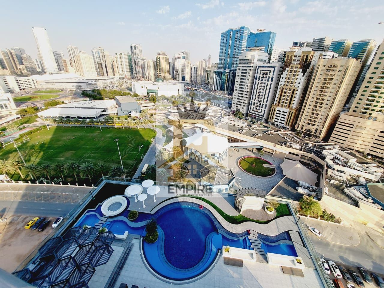 brand new building with balcony open view wardrobes good finishing gym pool and maintenance free also parking free prime location on main road building near close exit to dubai