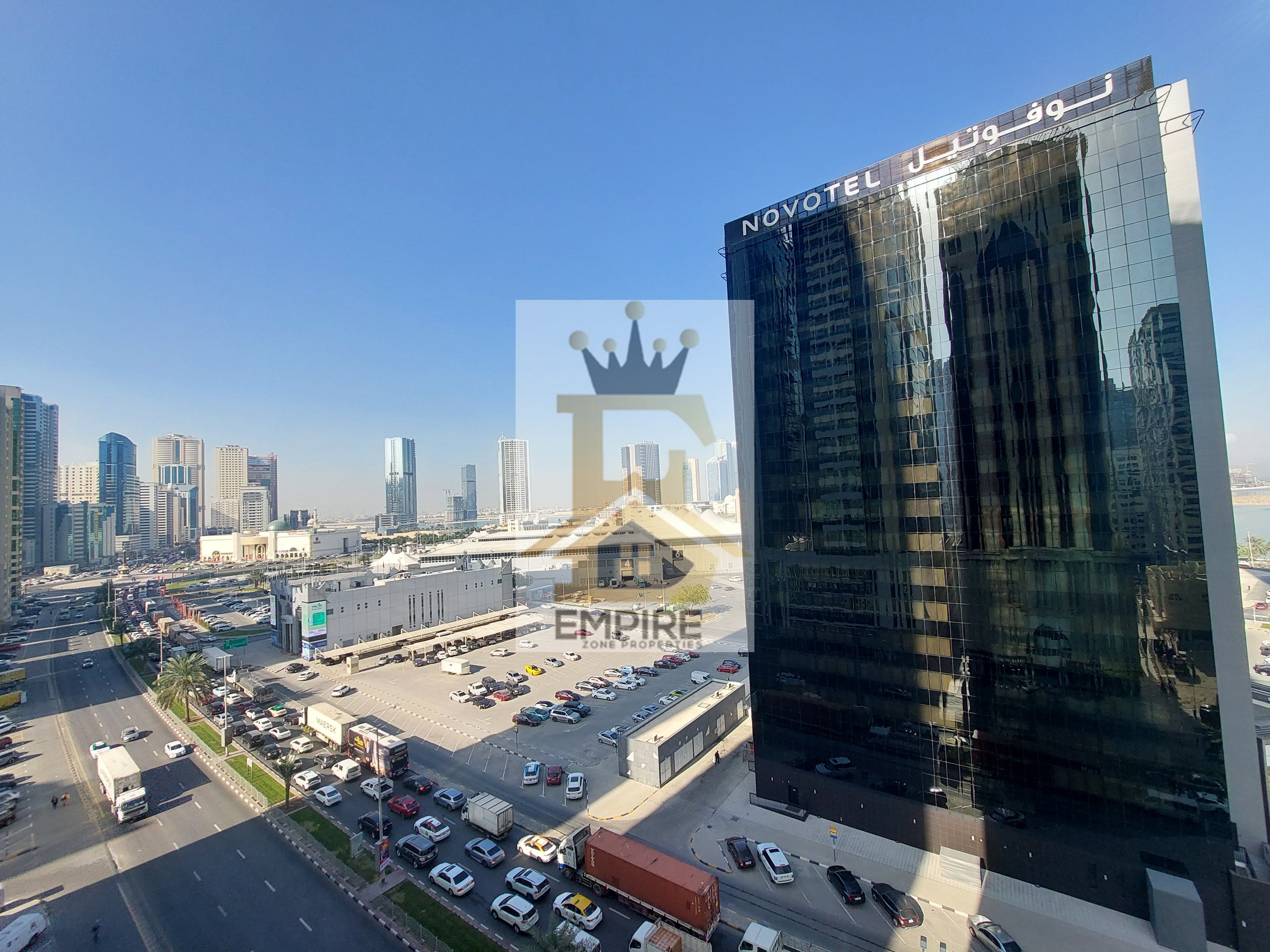 luxury living with partial sea view good finishing maintenance free prime location on main road building near close exit to dubai