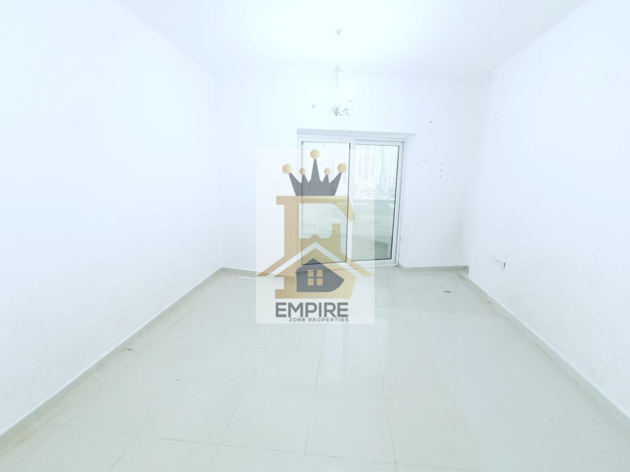 spacious living with balcony open view good finishing gym free and maintenance free prime location near close exit to dubai
