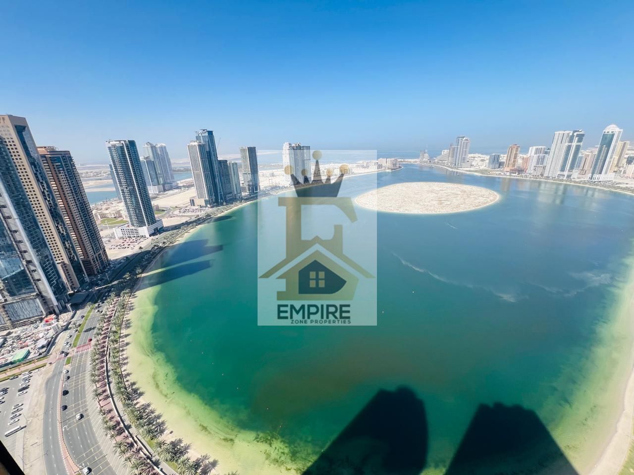 Full sea view parking free two balconies all room wardrobes luxury living with maid room washroom gym&pool and maintenance free prime location on main road building near close exit to dubai