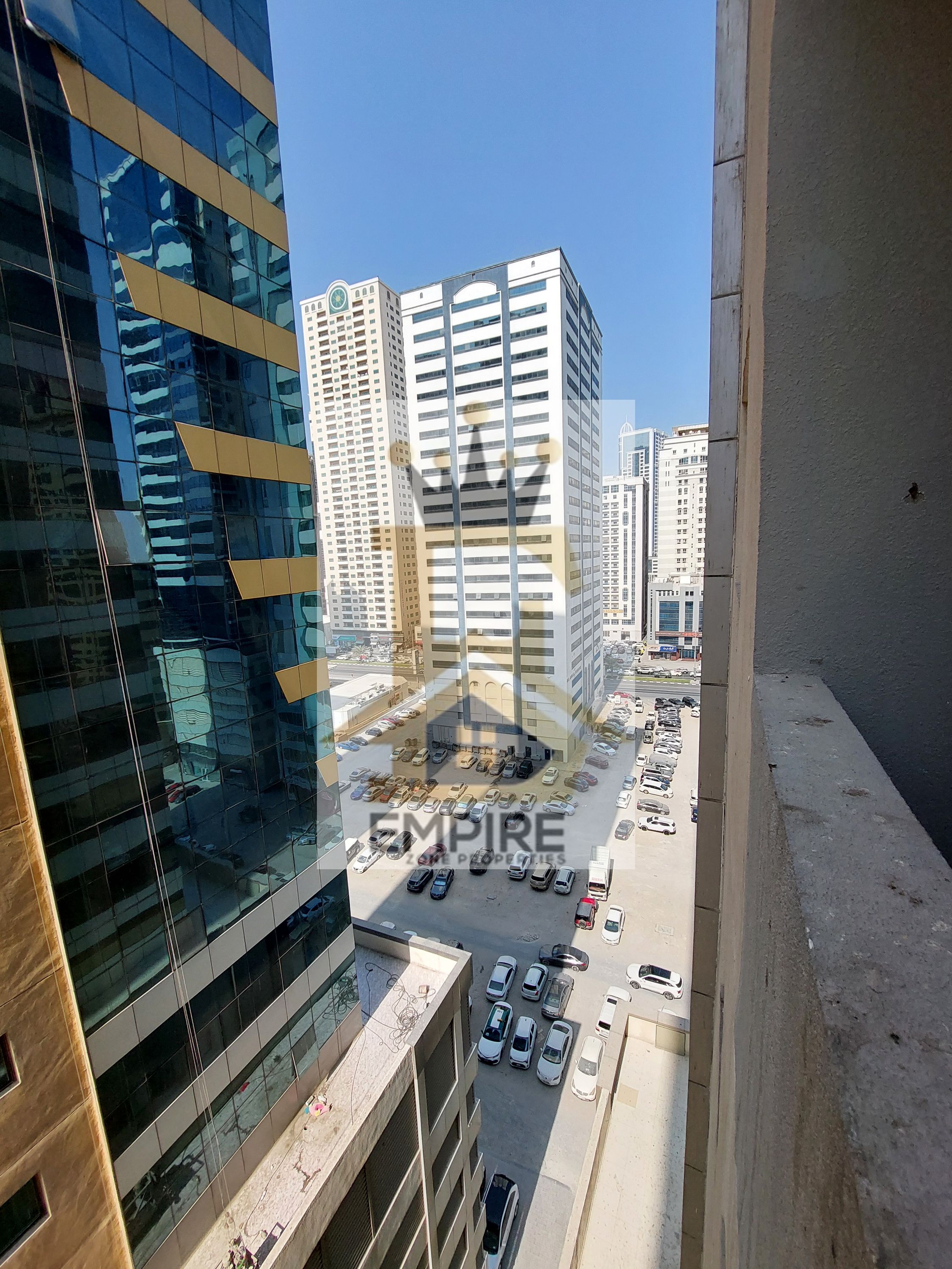 spacious living with balcony open view good finishing wardrobes gym&pool and maintenance free also parking free prime location near close exit to dubai