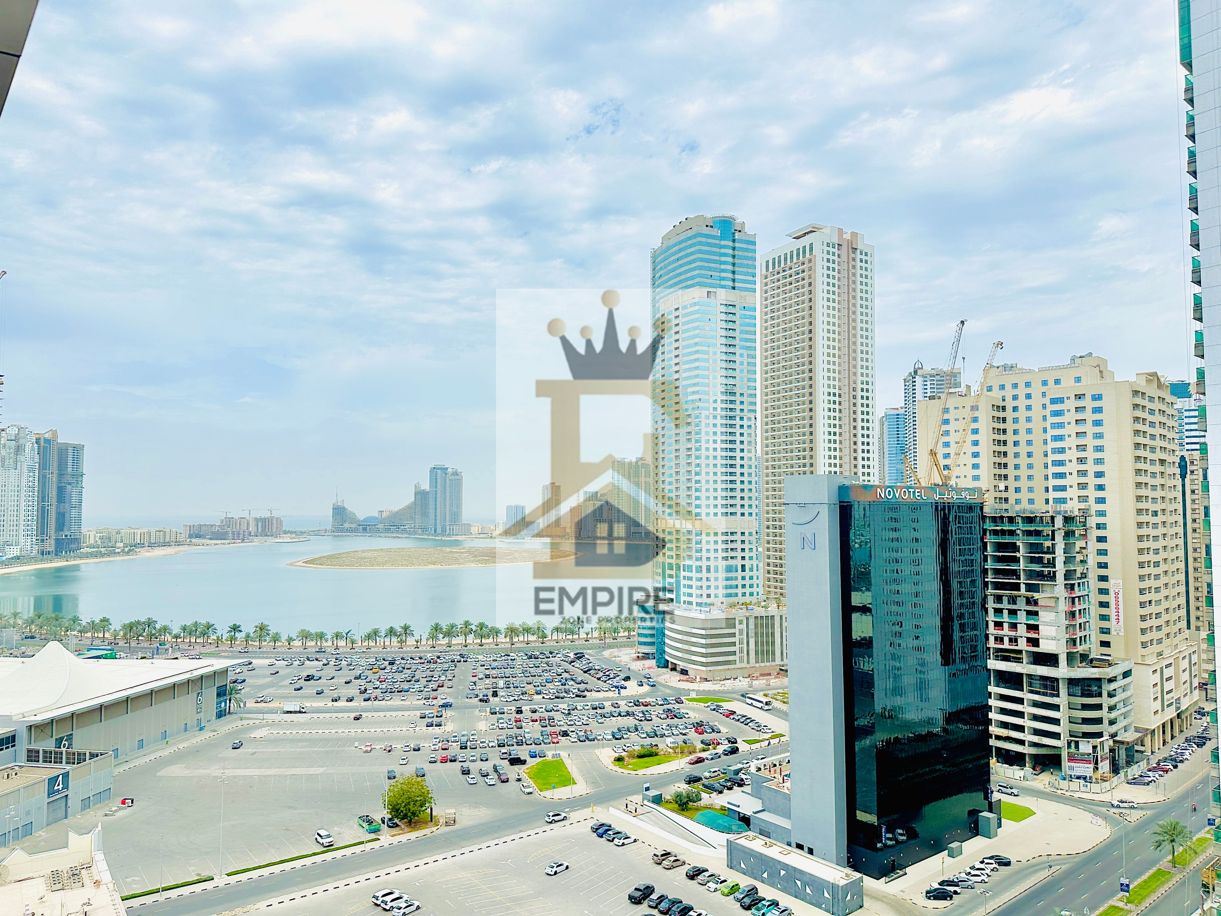 Spacious apartment with Sea view one month Freee easy exited Dubaii MAINTENANCE Freee with 6 Cheques payment opposite of expo Sharjah in al taawun