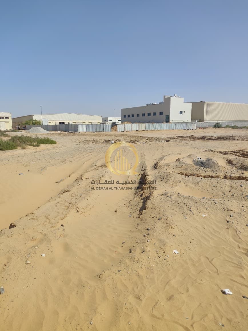 For sale: land in the Emirates Industrial City in an excellent location, Block (4), Scrap Area. With an area of 112,000 sq. ft.