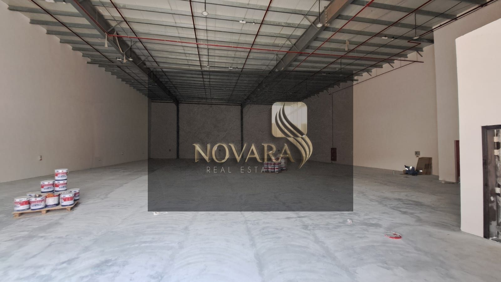 5500 sq ft warehouse in Umm Al Quwain, open space without mezzanine, 36 kW electricity, total price AED 247,500 per year