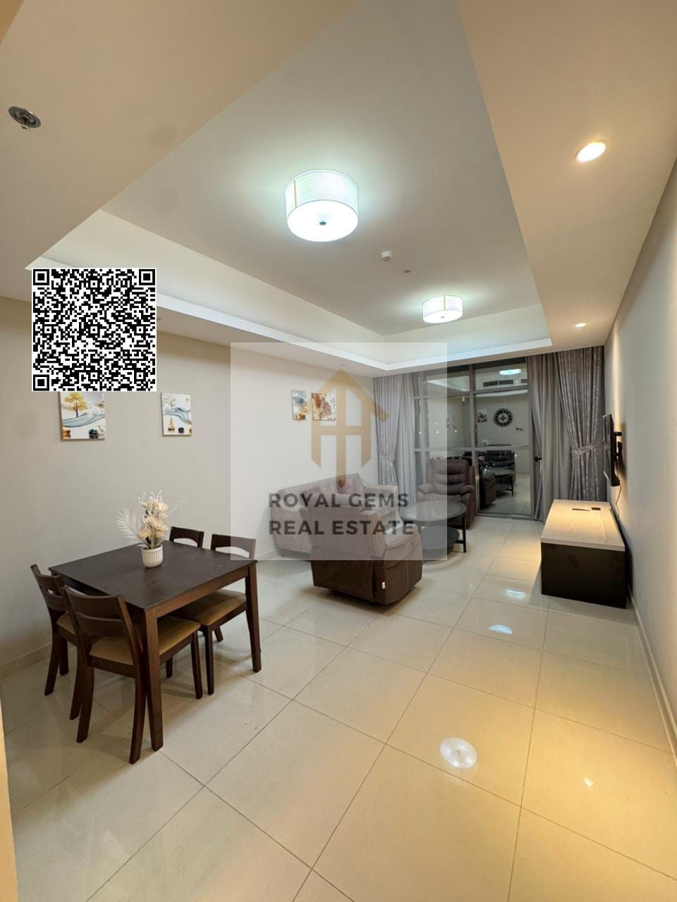 Luxurious one-bedroom apartment with a balcony and open view of the clock tower. Fully furnished, in a prime location with gym, pool, and parking
