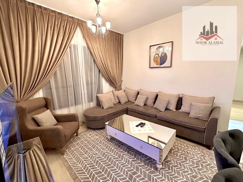 Sharjah, Al Taawun area, new building, hotel-style furnished apartment, two bedrooms, living room, kitchen, and two bathrooms. Price: 7500 AED
