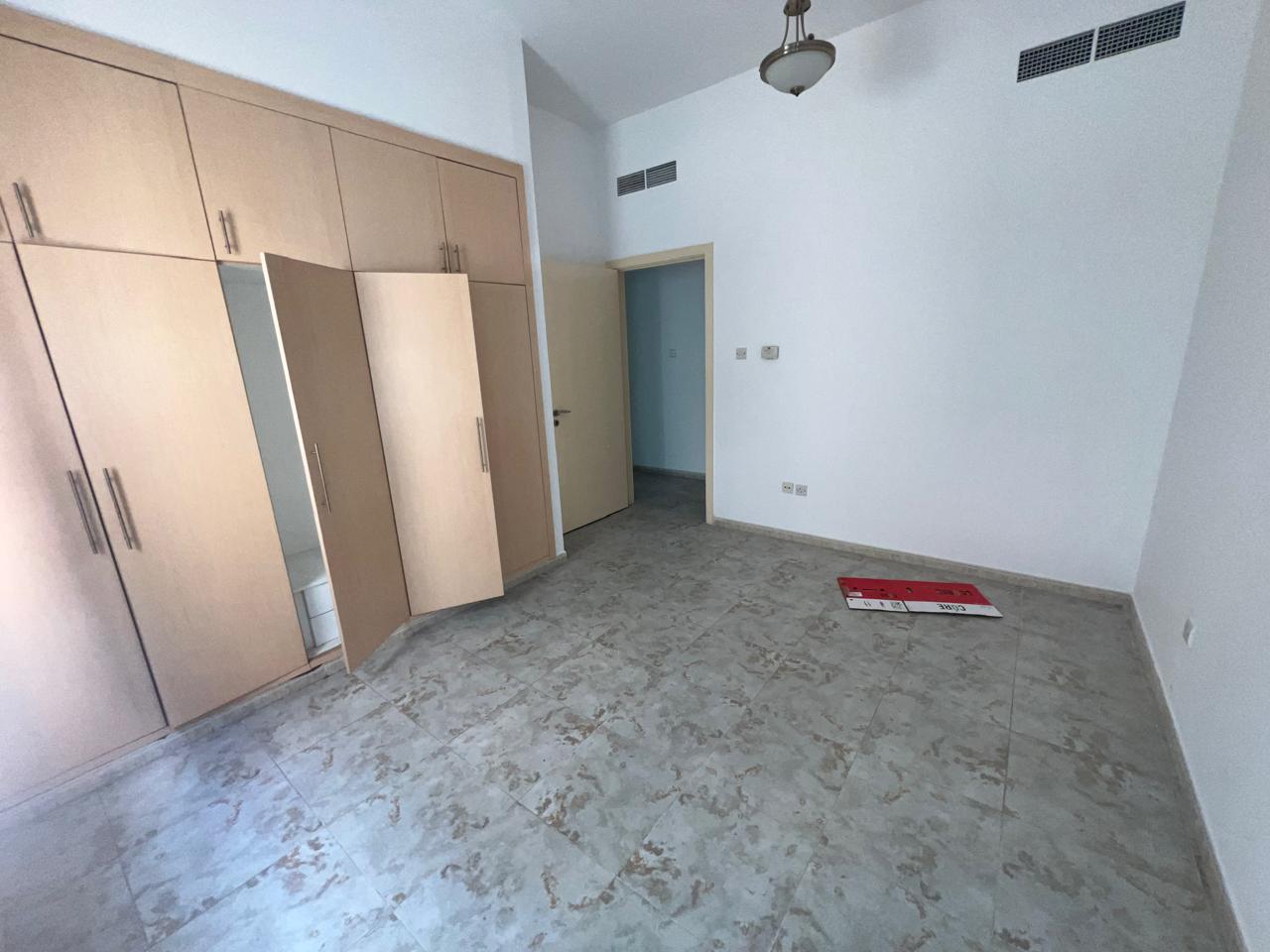 Two-bedroom apartment with hall in Al Majaz 3, side view, no balcony, laundry room, wardrobes, two bathrooms and free AC, rent AED 48,000