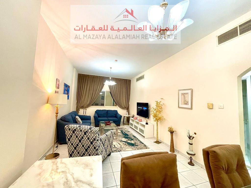 A fully furnished, super deluxe two-room apartment with a living room in Al Qasba - Sharjah, for monthly rent including all bills