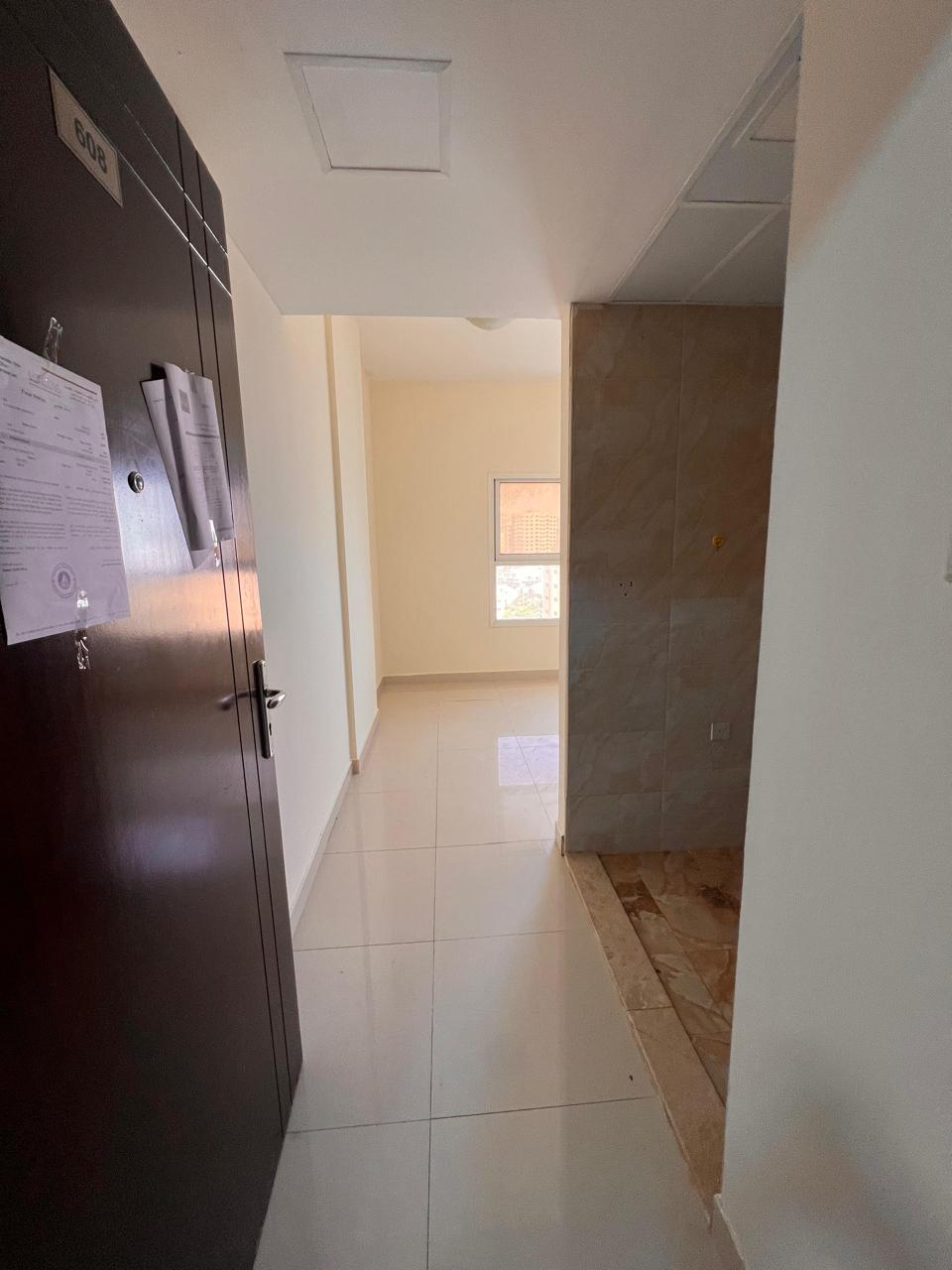 Studio with a semi-separated kitchen, central air conditioning, spacious areas, and a prime location opposite Sharjah and close to the Mohammed bin Za