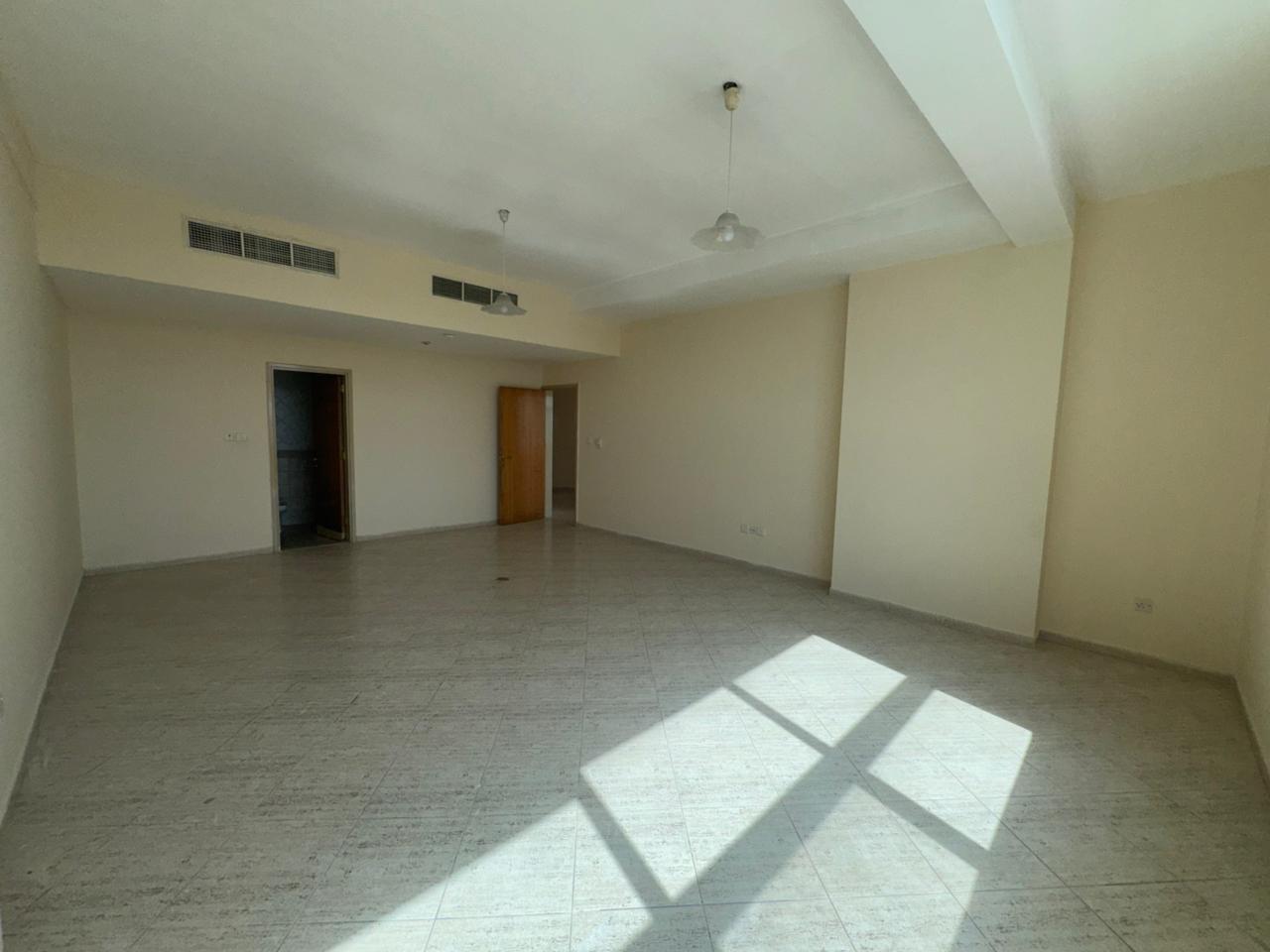 Two-bedroom apartment with hall in Al Majaz 2, open view, bright rooms, master bedroom, two bathrooms and free AC, annual rent AED 60,000.